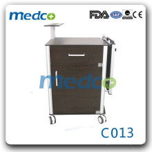 Hospital bedside cabinet with folding overbed table C013